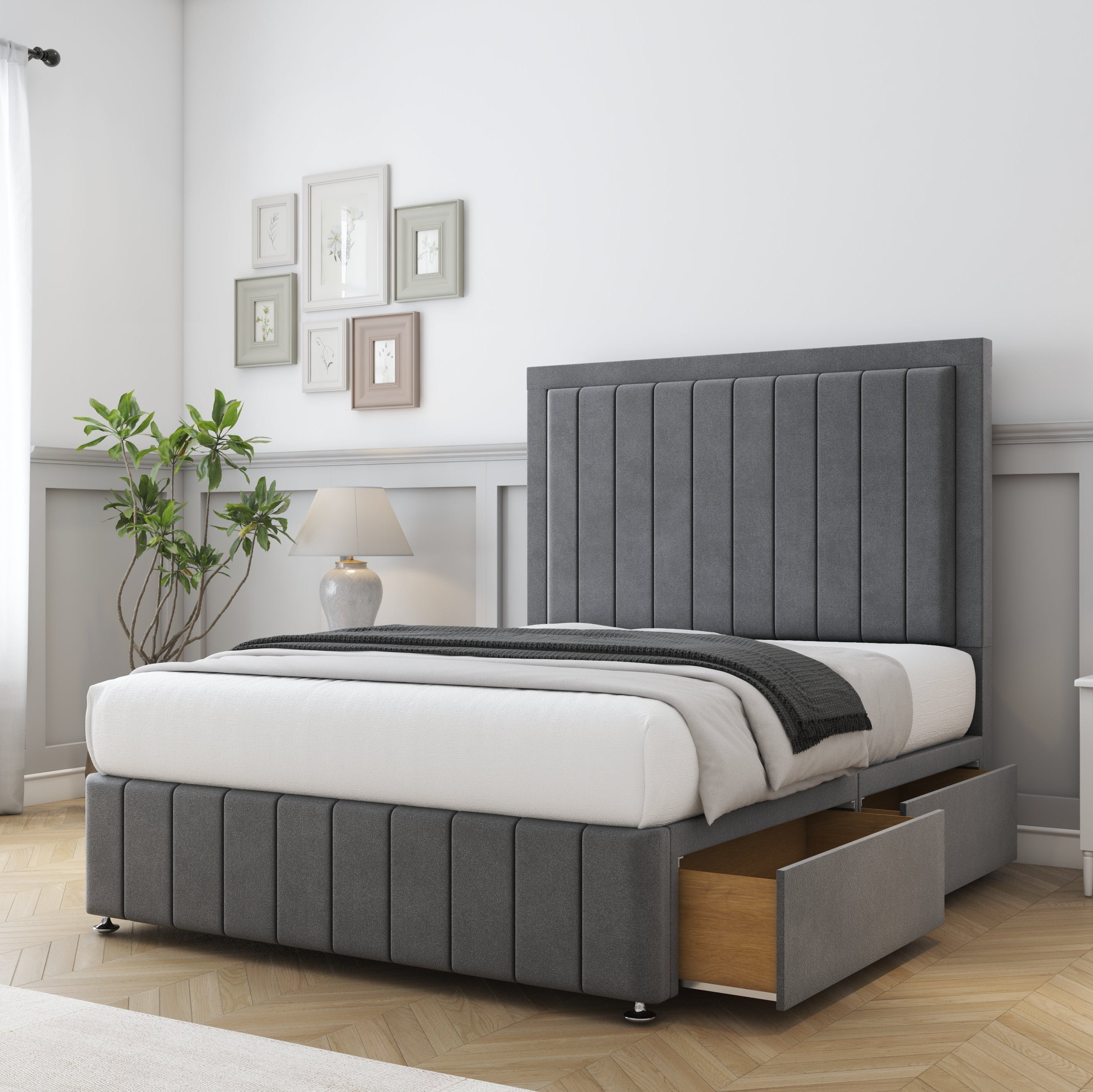 Gray upholstered bed with storage drawers in a bedroom setting.