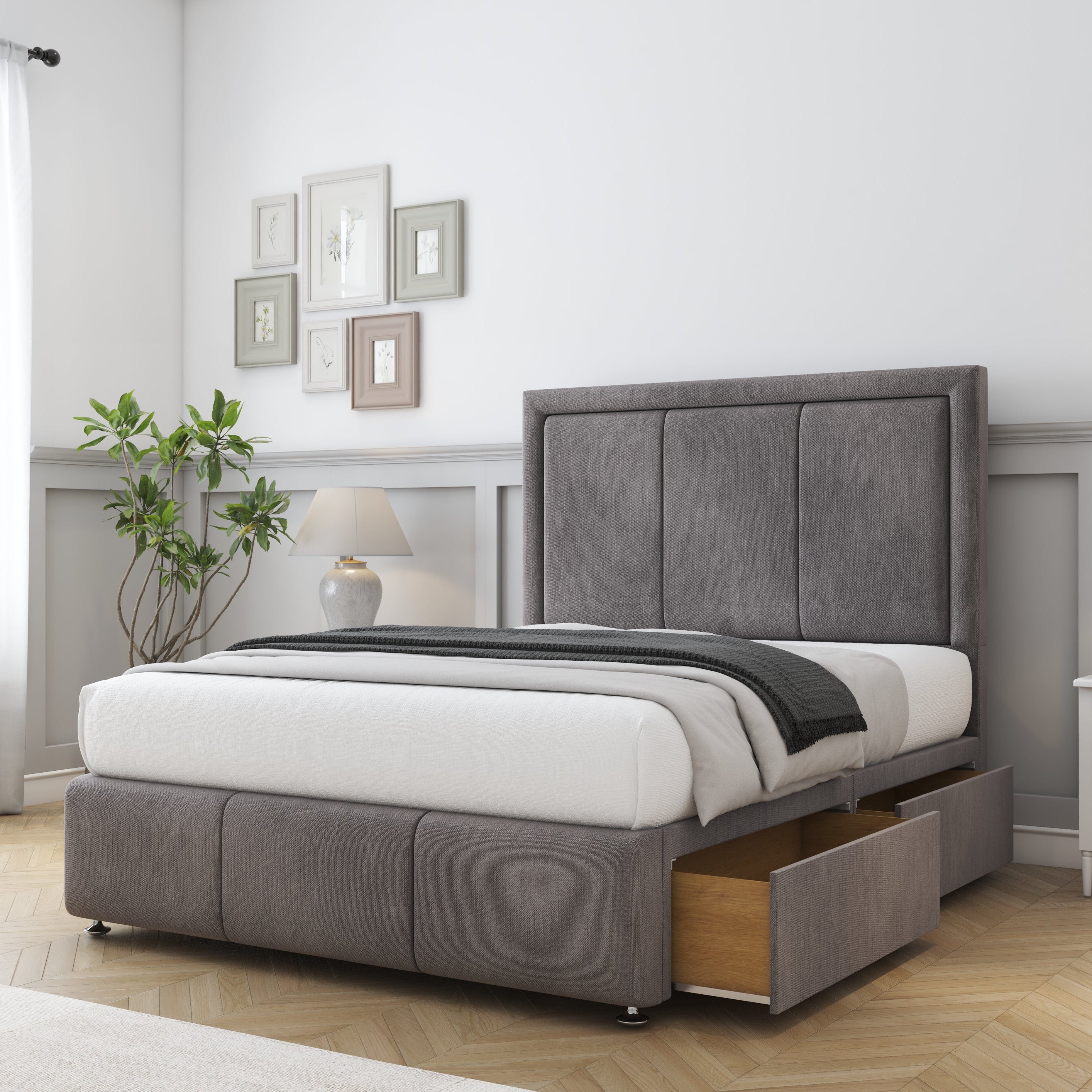 Gray upholstered bed with storage drawers in a bedroom setting.