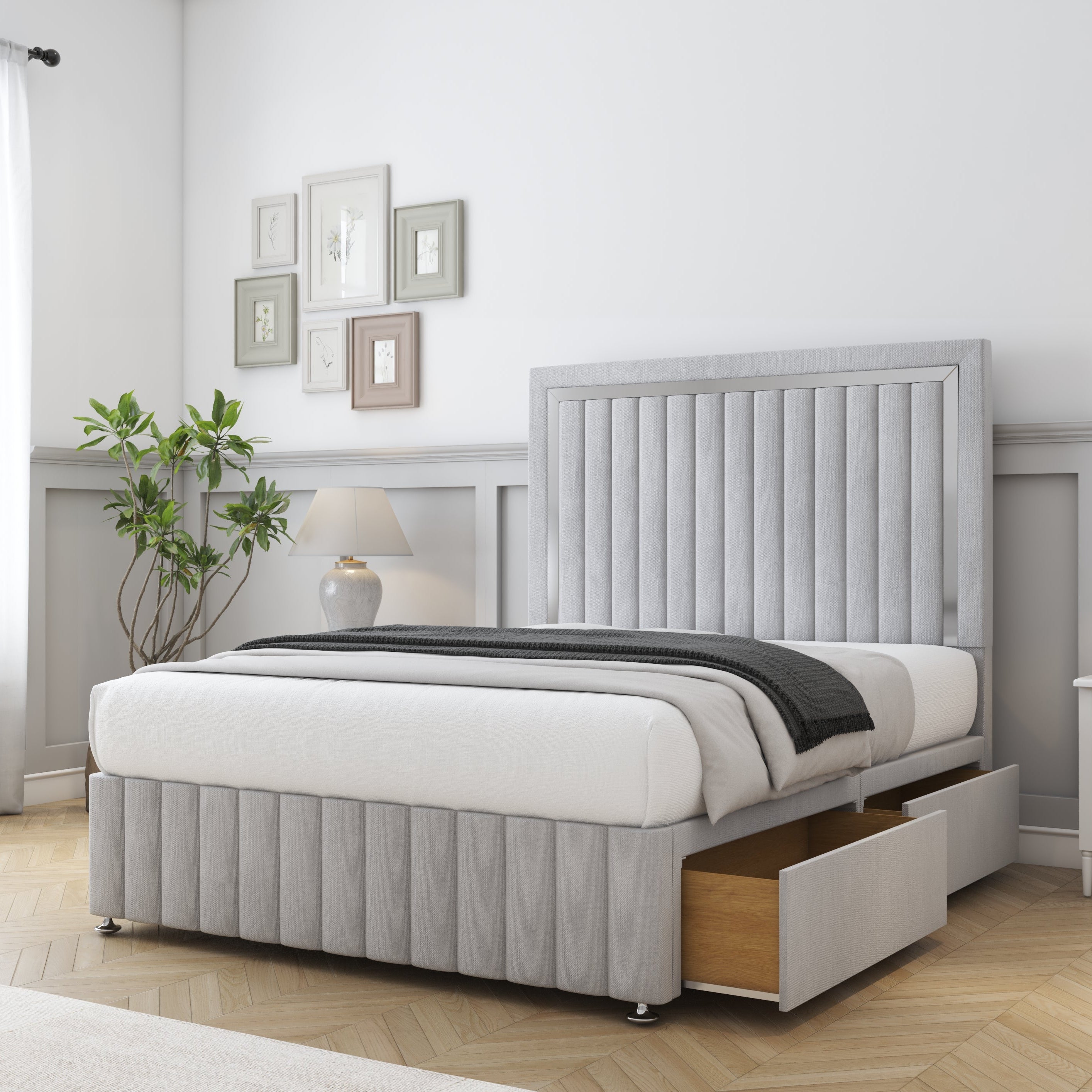 Gray upholstered bed with storage drawers in a bedroom setting.