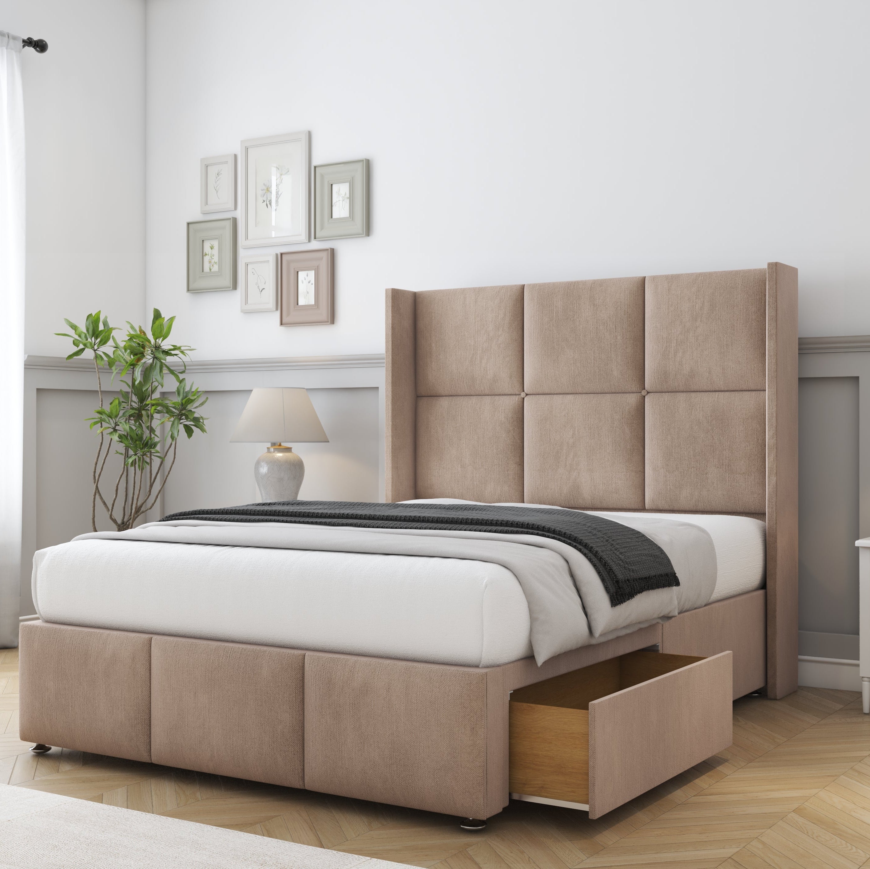 Beige upholstered bed with storage drawers in a bedroom setting.