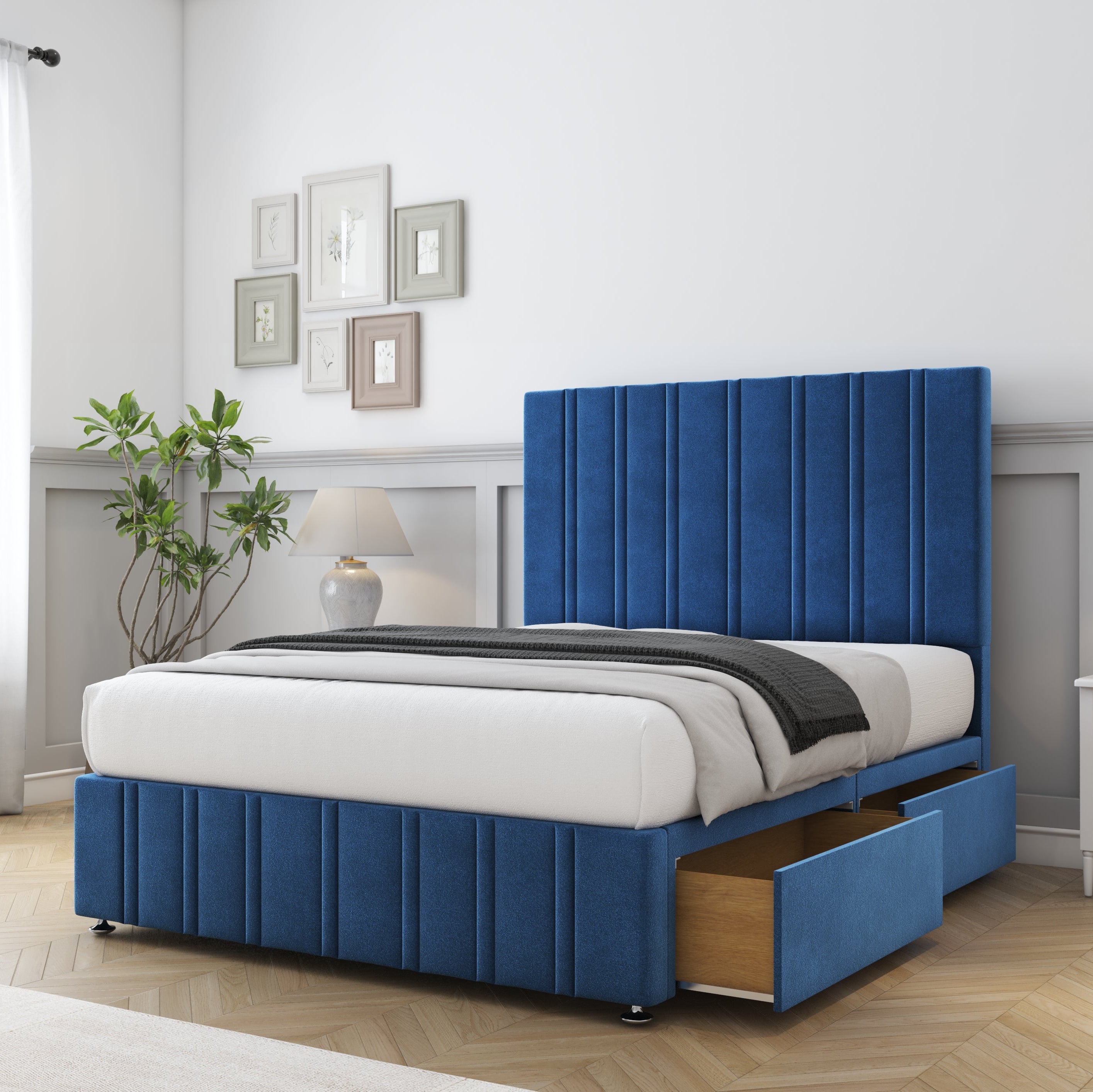 Blue upholstered bed with storage drawers in a bedroom setting.