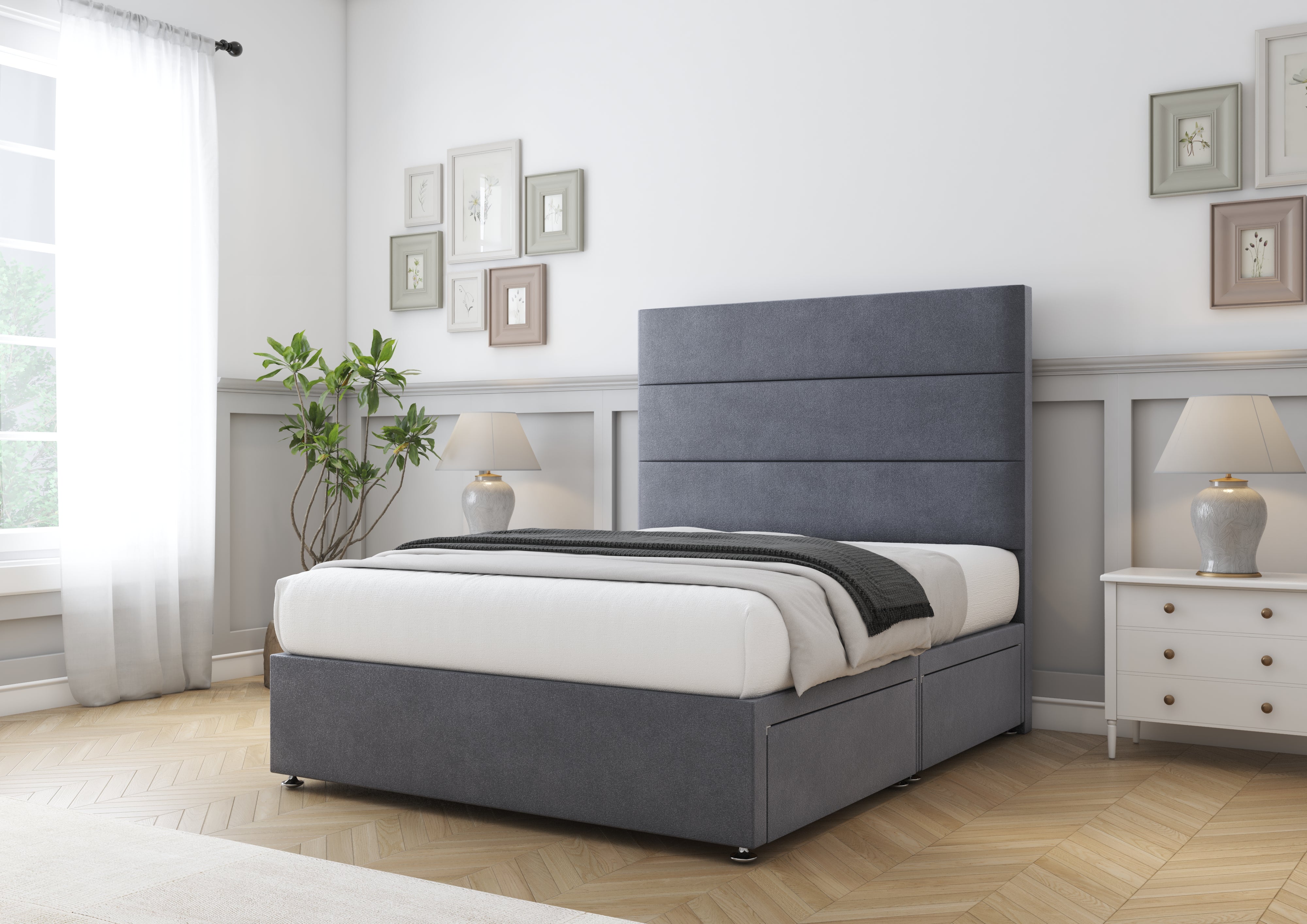 Pink bed in a bedroom with white walls and wooden flooring