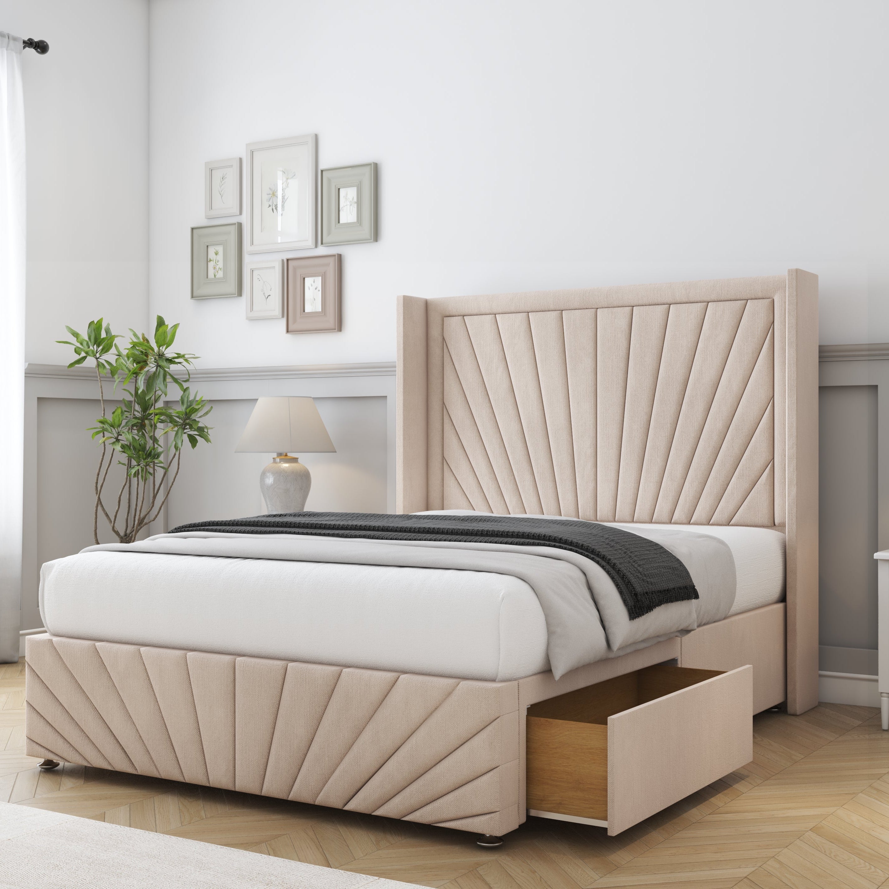 Beige upholstered bed with storage drawers in a bedroom setting.